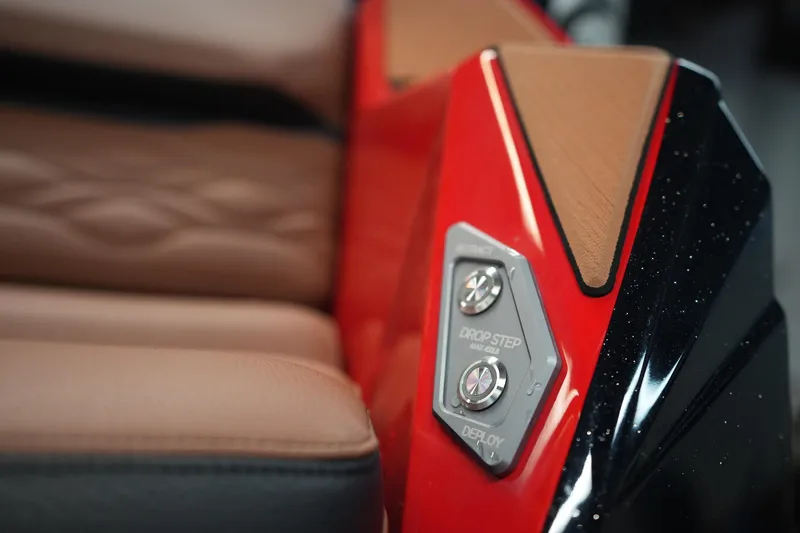 Slide: The Image of 2026 Supra SA interior detail with red and black accents, featuring drop step controls. - 9