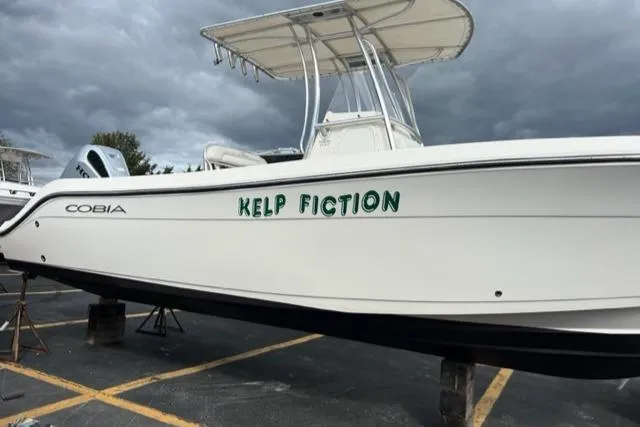 Slide: The Image of Cobia 237 Center Console boat with "Kelp Fiction" lettering, 2020 model. - 2