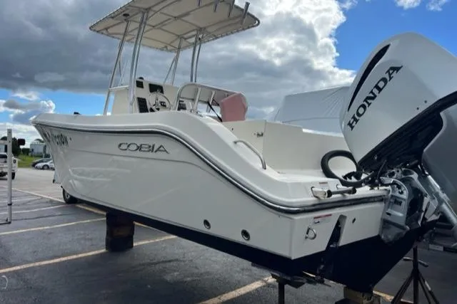 Slide: The Image of 2020 Cobia 237 Center Console boat with Honda engine. - 4