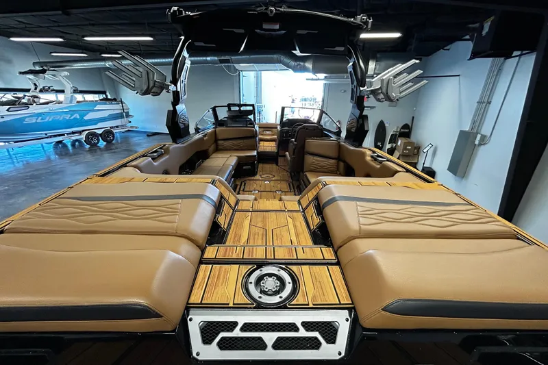 Slide: The Image of 2025 Supra SL boat interior with luxurious tan seating and modern design. - 4