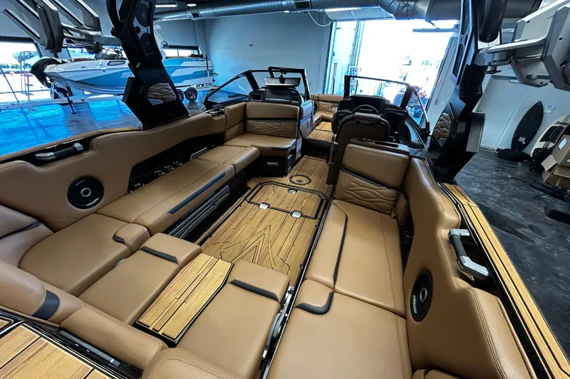 Slide: The Image of Luxurious interior of 2025 Supra SL boat with tan leather seating and wood flooring. - 5