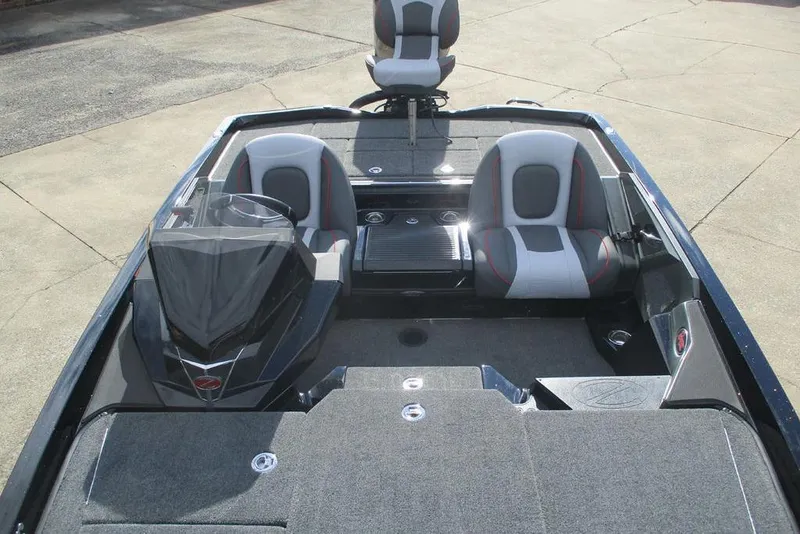 Slide: The Image of 2026 Ranger Z518 Cup-Equipped boat interior with seating and console. - 3