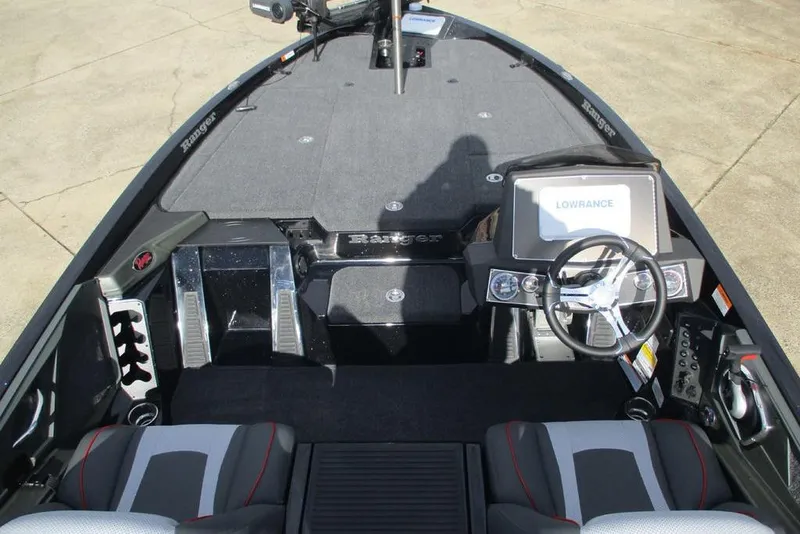 Slide: The Image of 2026 Ranger Z518 Cup-Equipped boat interior with steering wheel and navigation system. - 6