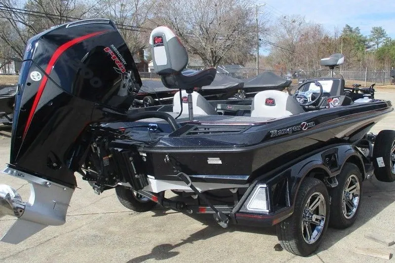 Slide: The Image of 2026 Ranger Z518 Cup-Equipped boat with powerful outboard motor, parked on trailer. - 8
