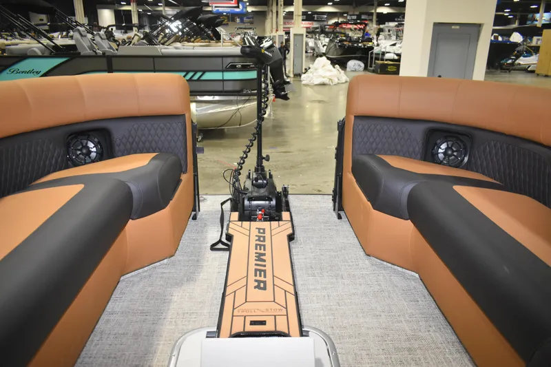 Slide: The Image of 2026 Premier 230 Angler 2 Point boat interior with tan and black seating. - 10