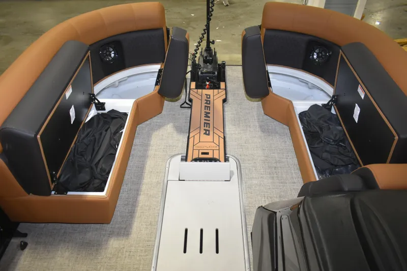 Slide: The Image of 2026 Premier 230 Angler 2 Point boat interior with tan seating and storage compartments. - 11