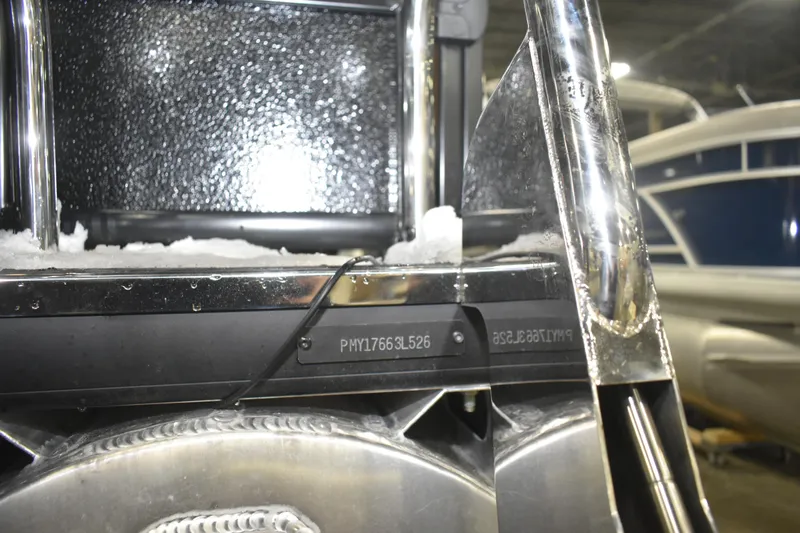 Slide: The Image of Close-up of 2026 Premier 230 Angler 2 Point boat with visible serial number. - 13