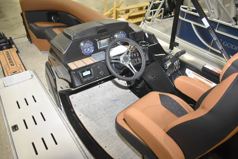 Slide: The Image of Interior view of 2026 Premier 230 Angler 2 Point boat with modern dashboard and seating. - 2