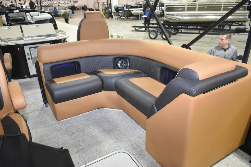 Slide: The Image of Luxurious seating on 2026 Premier 230 ANGLER 2 POINT boat, featuring tan and black upholstery. - 4