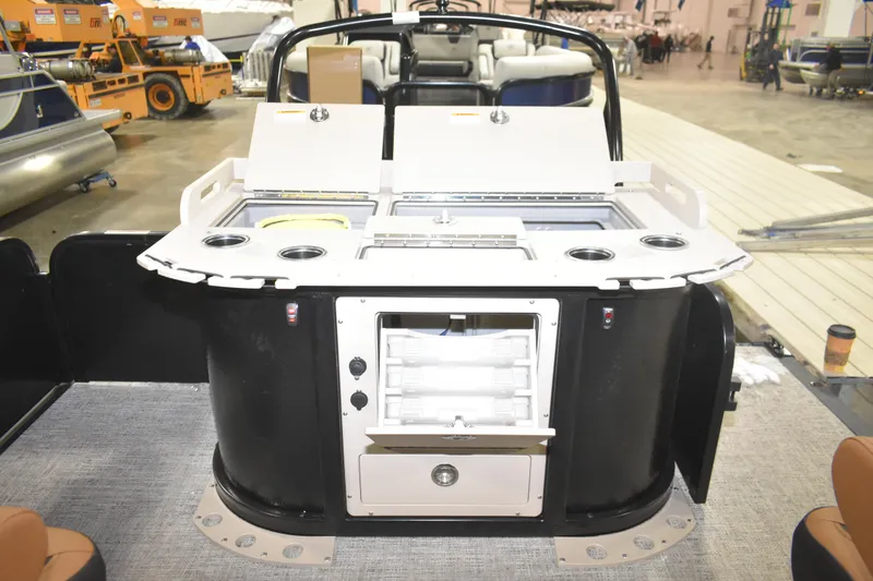 Slide: The Image of 2026 Premier 230 Angler 2 Point boat interior with fishing station and storage compartments. - 6