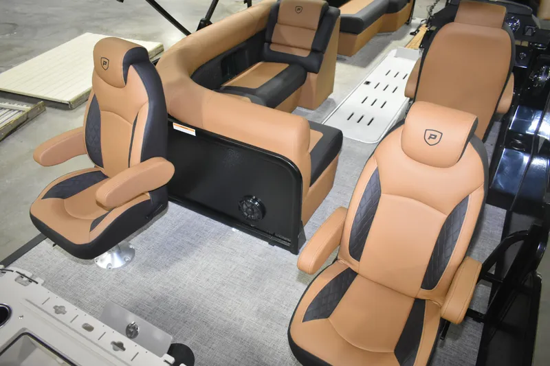 Slide: The Image of 2026 Premier 230 Angler 2 Point boat interior with tan and black seating. - 7