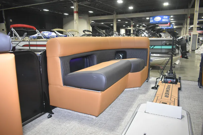 Slide: The Image of 2026 Premier 230 Angler 2 Point boat interior with tan and gray seating. - 8