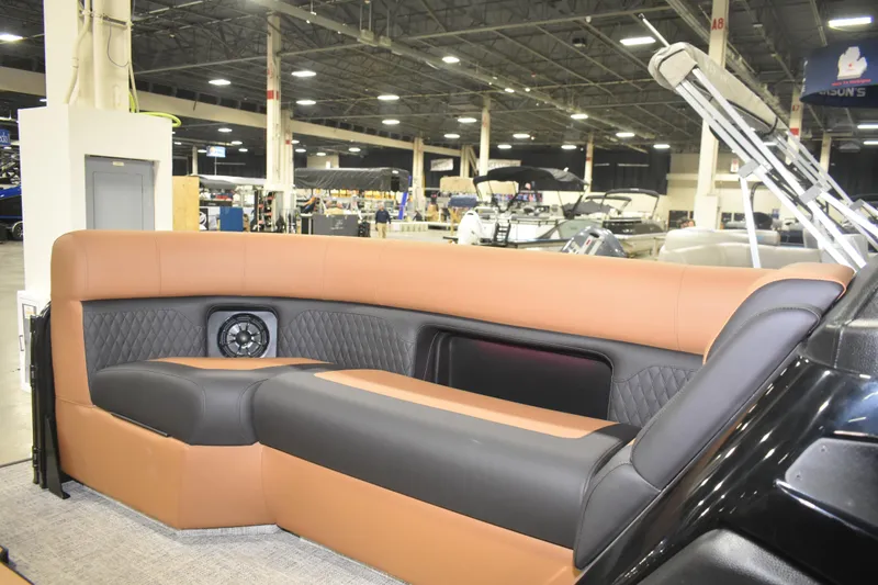 Slide: The Image of Luxurious seating in the 2026 Premier 230 ANGLER 2 POINT boat at an indoor showroom. - 9