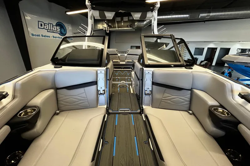 Slide: The Image of 2025 Supra SL boat interior with luxurious seating and modern design at Dallas Boathouse. - 9