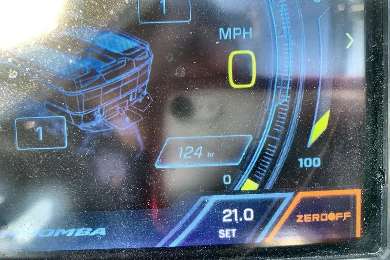 Slide: The Image of Dashboard display of 2023 Moomba Mojo boat showing 124 hours and speedometer. - 22
