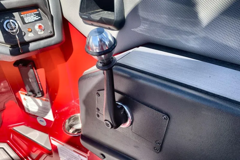 Slide: The Image of 2023 Moomba Mojo boat control panel with throttle lever and ignition switch. - 15