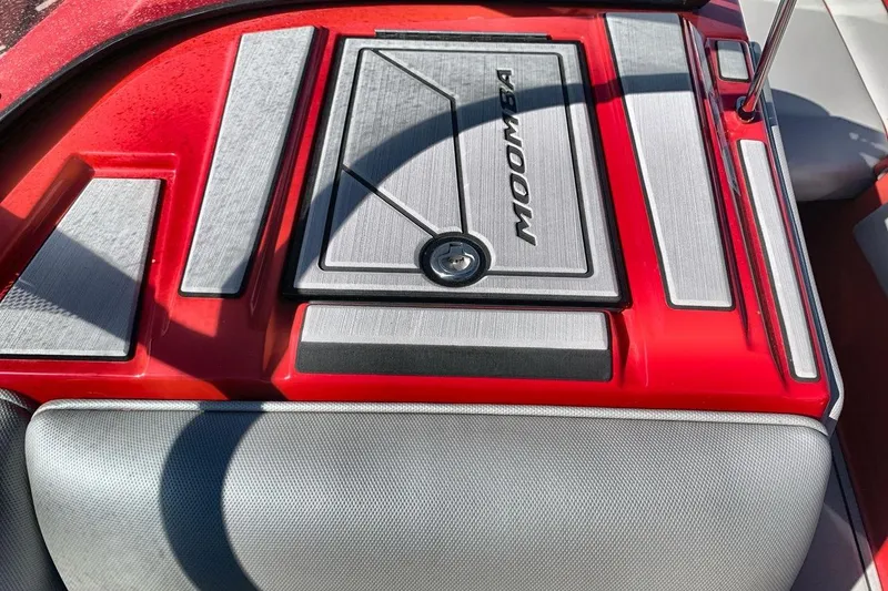 Slide: The Image of 2023 Moomba Mojo boat interior with red and gray accents. - 18