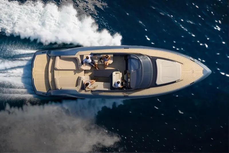 Slide: The Image of Aerial view of 2026 Flynt Yachts Revolante 48 cruising on open water. - 6