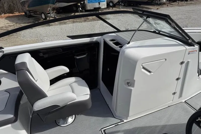 Slide: The Image of 2026 Yamaha Boats AR250 interior with white seating and sleek design. - 10