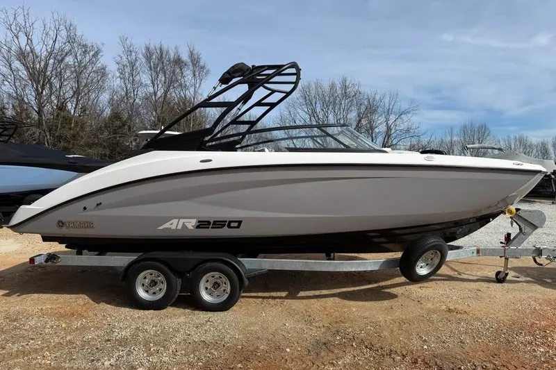 Slide: The Image of 2026 Yamaha Boats AR250 on trailer, parked outdoors, showcasing sleek design and modern features. - 3