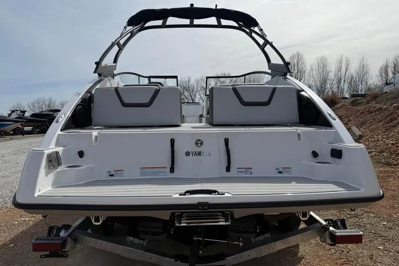 Slide: The Image of 2026 Yamaha Boats AR250 rear view, showcasing sleek design and spacious seating. - 5