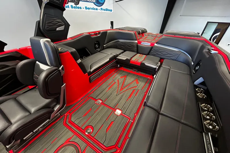 Slide: The Image of Luxurious interior of 2025 Supra SL boat with sleek black and red seating. - 7