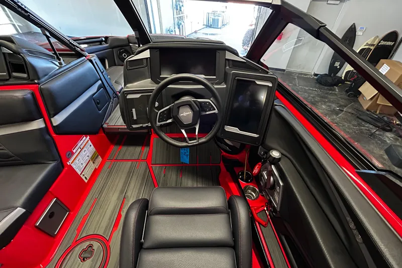 Slide: The Image of Interior of 2025 Supra SL boat with modern dashboard and steering wheel. - 8