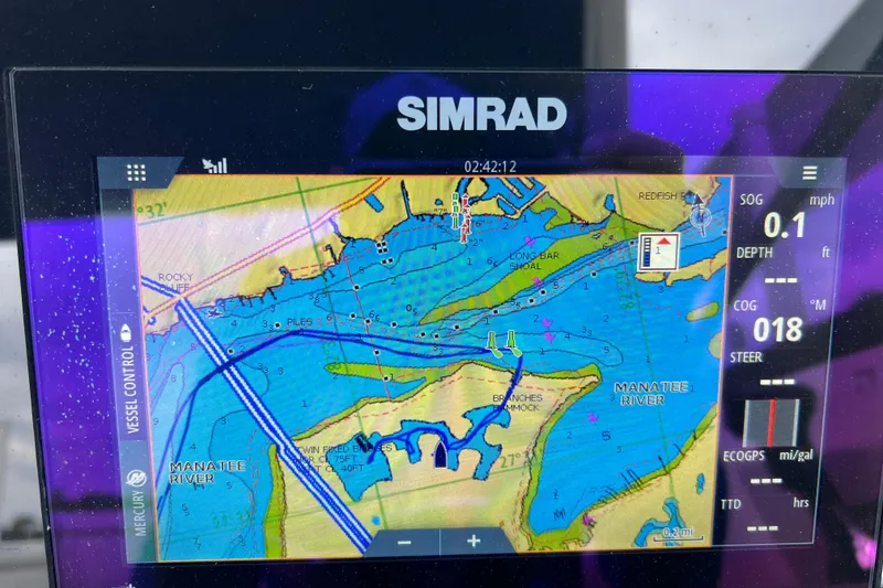Slide: The Image of Simrad navigation display on 2020 Sea Ray SDX 270 Outboard, showing Manatee River map. - 12