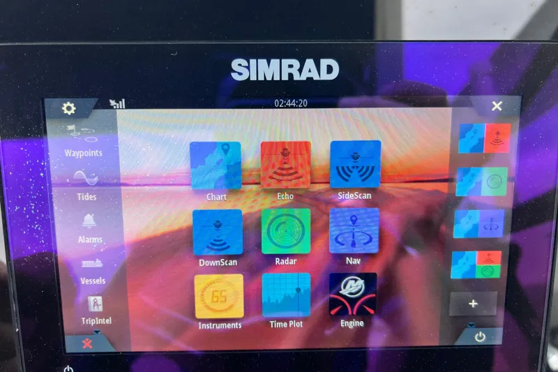 Slide: The Image of Simrad marine display on 2020 Sea Ray SDX 270 Outboard, showing navigation and sonar options. - 13