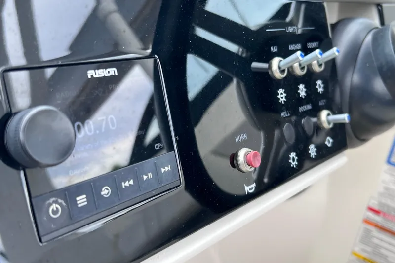 Slide: The Image of Control panel of 2020 Sea Ray SDX 270 Outboard with Fusion audio system. - 17