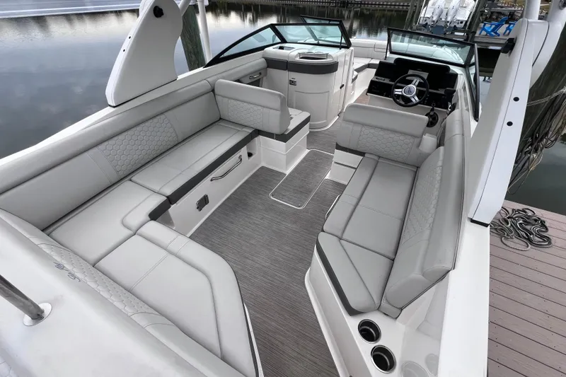 Slide: The Image of 2020 Sea Ray SDX 270 Outboard boat interior with spacious seating and modern design. - 19