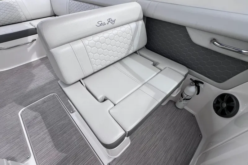 Slide: The Image of 2020 Sea Ray SDX 270 Outboard interior with white seating and hexagonal pattern design. - 25