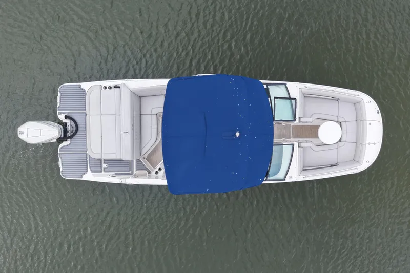 Slide: The Image of Overhead view of 2020 Sea Ray SDX 270 Outboard boat with blue canopy on water. - 3