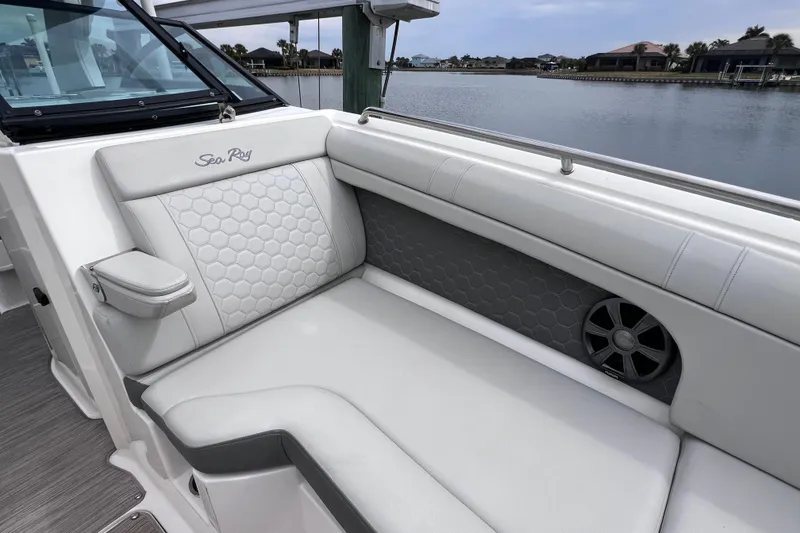 Slide: The Image of 2020 Sea Ray SDX 270 Outboard boat interior with white cushioned seating. - 32