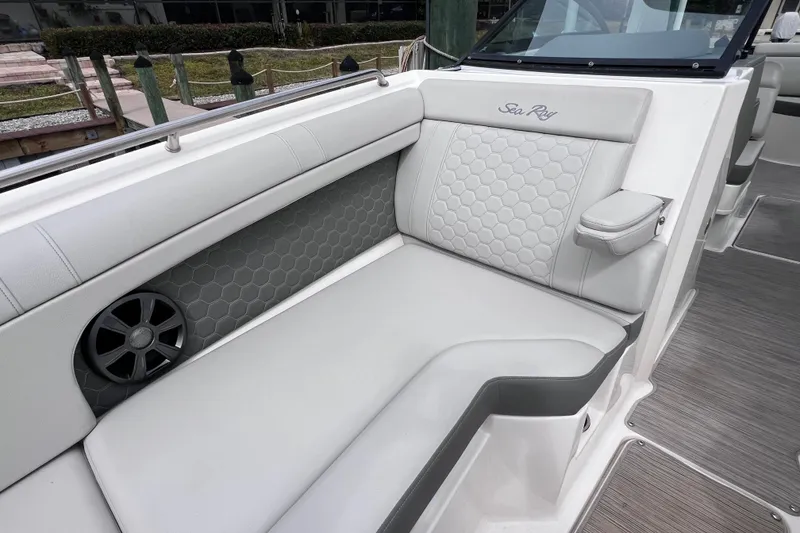 Slide: The Image of 2020 Sea Ray SDX 270 Outboard interior with luxurious seating and speaker detail. - 33