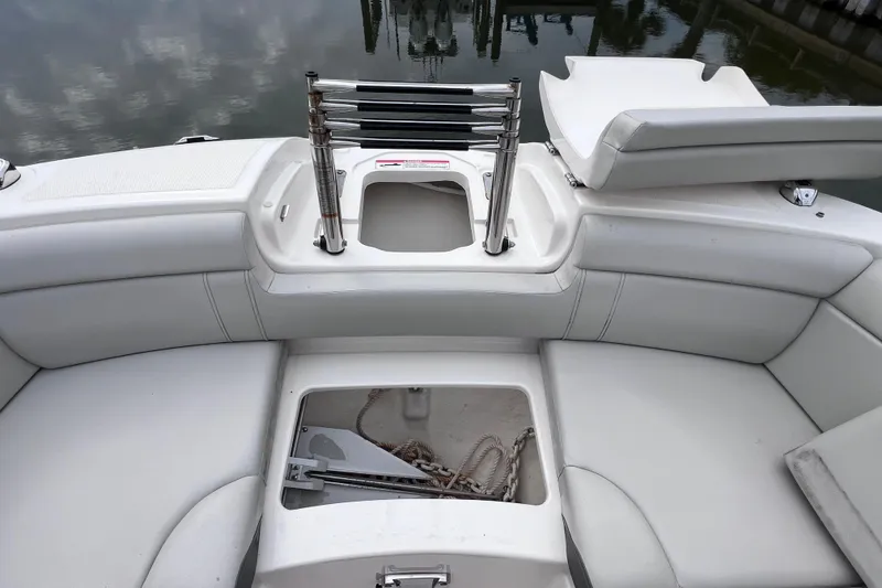 Slide: The Image of 2020 Sea Ray SDX 270 Outboard boat interior with seating and storage compartments. - 52