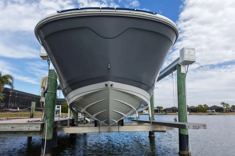 Slide: The Image of 2020 Sea Ray SDX 270 Outboard boat on lift, dockside view. - 8