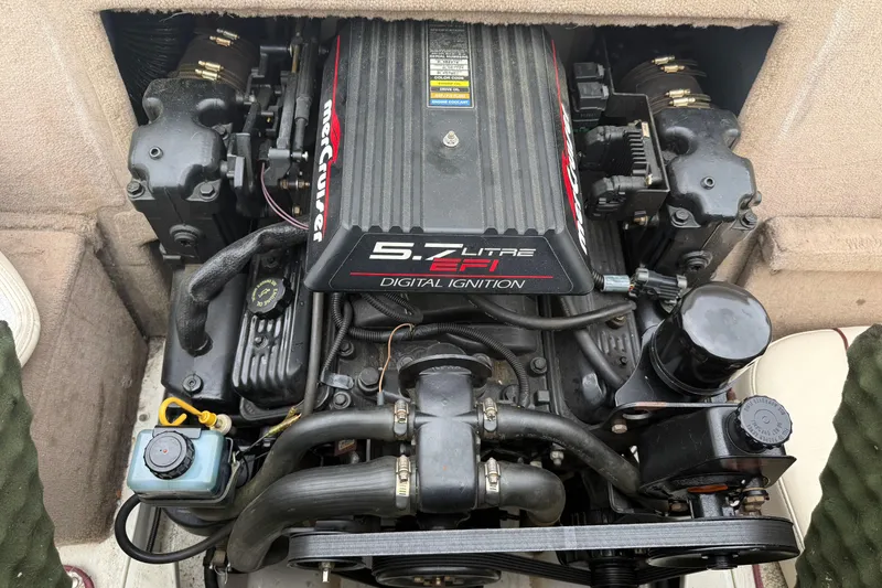 Slide: The Image of Engine of a 2000 Sea Ray 210 Bow Rider boat, featuring 5.7L EFI digital ignition. - 12