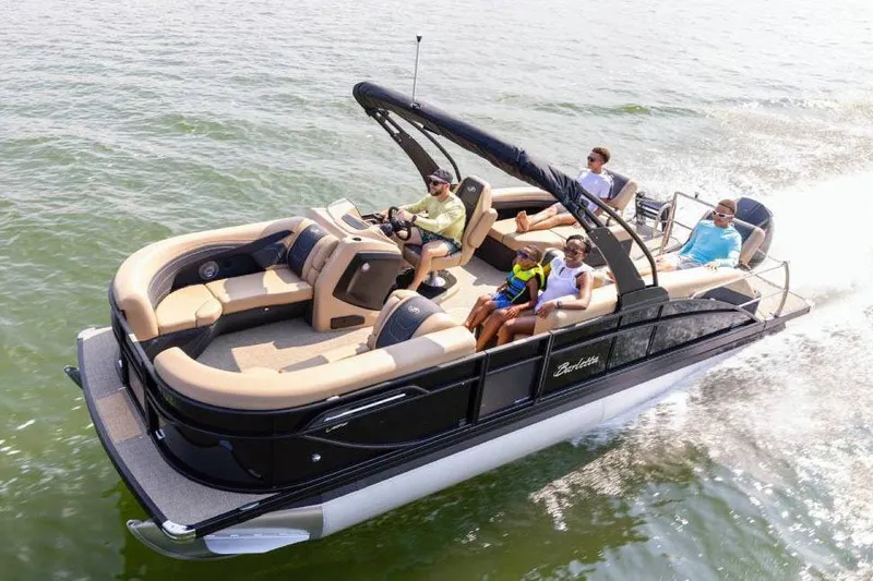 Slide: The Image of Manufacturer Provided Image: 2026 Barletta Cabrio 22M pontoon boat cruising with passengers on a sunny day. - 9