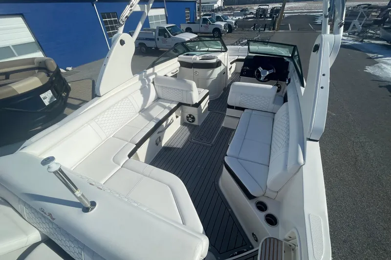 Slide: The Image of 2020 Sea Ray SDX 270 Outboard boat interior with white seating and modern design. - 12