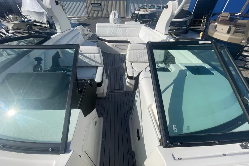 Slide: The Image of 2020 Sea Ray SDX 270 Outboard boat interior with spacious seating and modern design. - 19