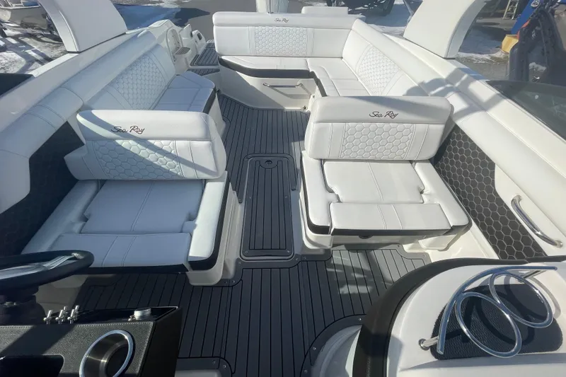 Slide: The Image of 2020 Sea Ray SDX 270 Outboard interior with luxurious white seating and sleek design. - 20