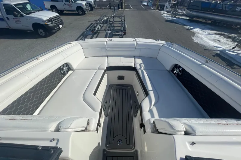 Slide: The Image of 2020 Sea Ray SDX 270 Outboard boat interior with white seating and black accents. - 21