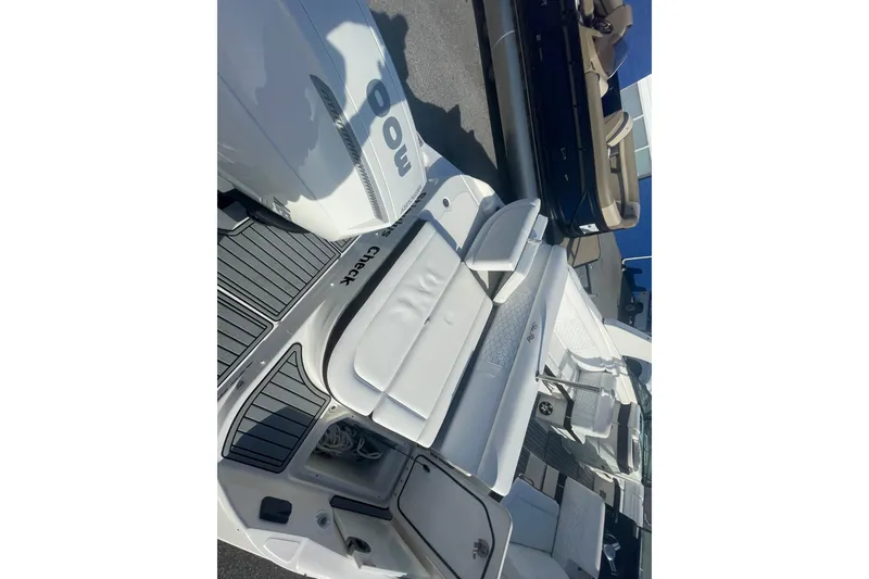 Slide: The Image of 2020 Sea Ray SDX 270 Outboard boat with white seating and sleek design. - 9