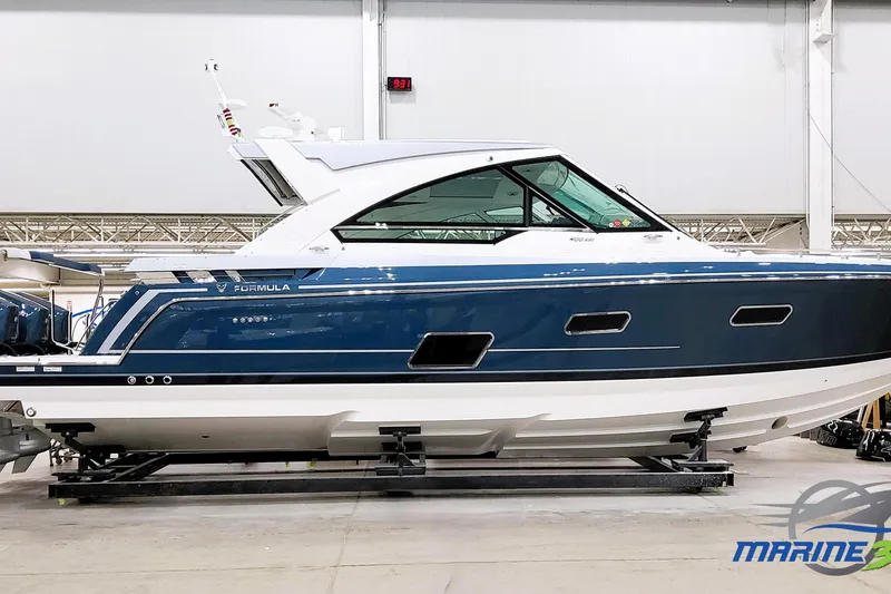 The Image of 2026 Formula 400 Super Sport Crossover boat in a showroom, side view. - 0