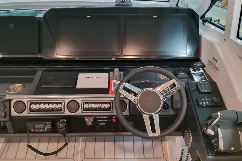 Slide: The Image of 2026 Formula 400 Super Sport Crossover dashboard with advanced controls and steering wheel. - 10