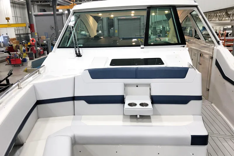 Slide: The Image of 2026 Formula 400 Super Sport Crossover boat interior with seating and cup holders. - 19