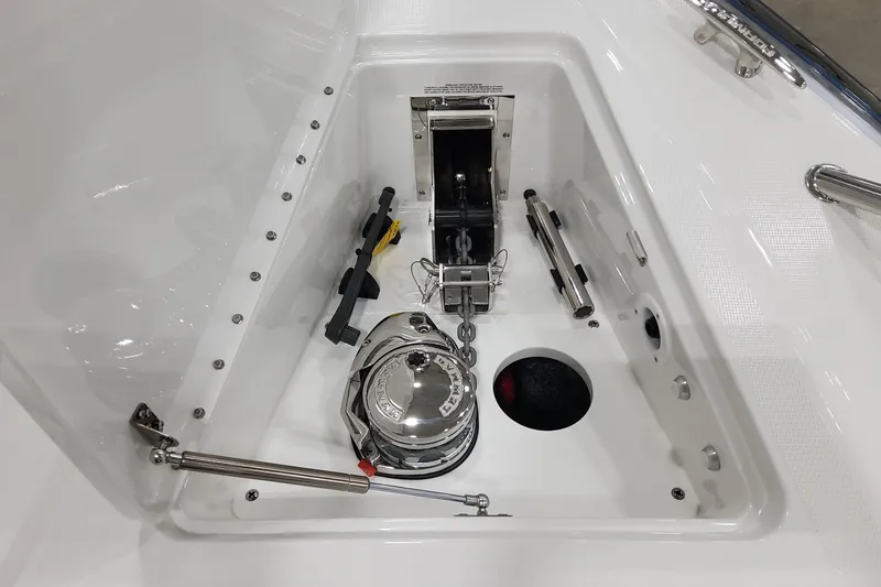 Slide: The Image of Anchor compartment of 2026 Formula 400 Super Sport Crossover boat, featuring winch and chain. - 20
