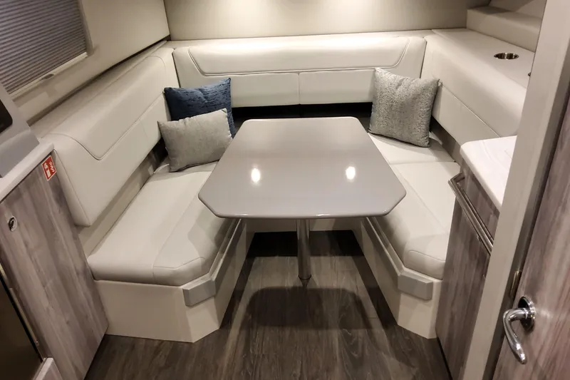 Slide: The Image of 2026 Formula 400 Super Sport Crossover interior with sleek dining area and plush seating. - 23