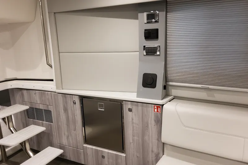 Slide: The Image of Interior of 2026 Formula 400 Super Sport Crossover, featuring modern cabinetry and control panel. - 24